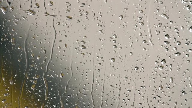 Look at the window with rain drops on the glass