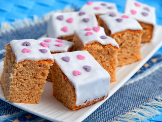 Homemade Caramel cake cut into squares, shot from above. Horizontal, close up shot