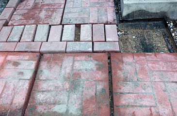 Laying of paving slabs on cement base