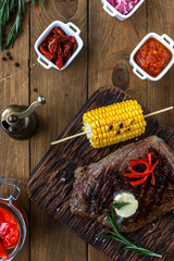 Grilled Black Angus Steak on wooden background 