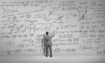 Man draw science formulas 