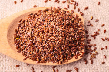 Flax seeds linseed on wooden spoon