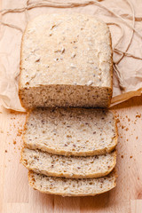 Sliced wholemeal bread on cutting board