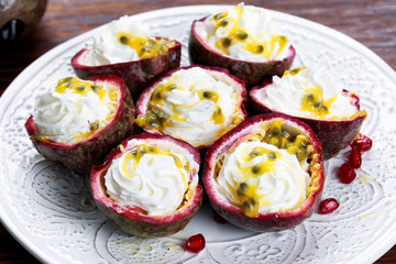 Ripe passion fruit on a wooden background