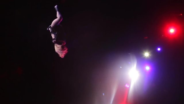 Girl performs dangerous stunt in the circus