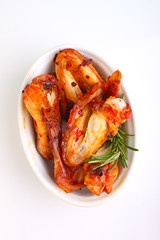 Chicken wings fried in tomato sauce