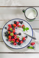 Sweet berry fruits with yogurt