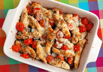 Italian chicken bake casserole with mozzarella, cherry tomatoes and oregano