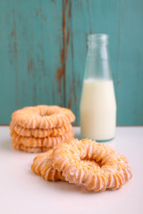 cookies with powdered sugar , a cup of tea