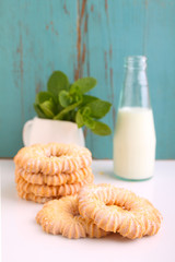 cookies with powdered sugar , a cup of tea