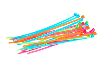Multi colored plastic strips separated on white background