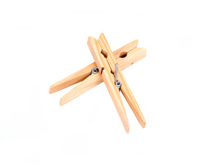 Natural wood clothespins separated on white background
