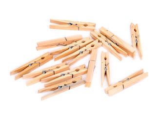 Natural wood clothespins separated on white background