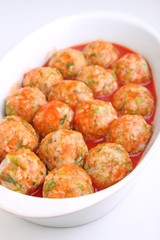 cutlets of meat and rice in tomato sauce