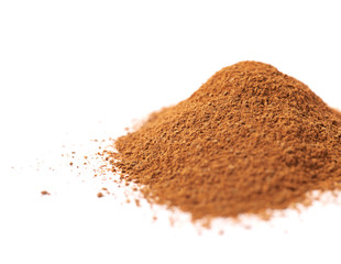 Pile of cinnamon powder isolated
