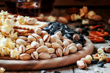 Salted pistachios on a vintage wooden background, selective focu © 5ph