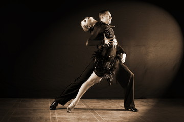 dancers in ballroom isolated on black background