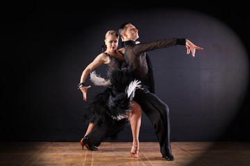 dancers in ballroom isolated on black background