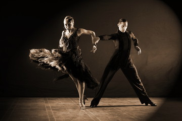 dancers in ballroom isolated on black background