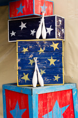 bowling pins and boxes of a circus