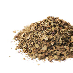 Pile of dried basil seasoning isolated
