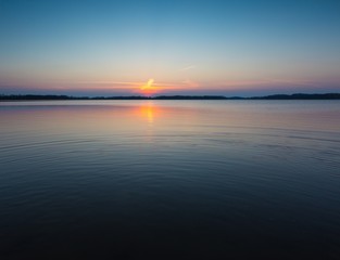 Fototapeta premium Lake at sunset in Mazury lake district in Poland