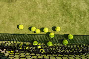 Tennis balls on the court.