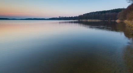 Fototapeta na wymiar Lake at sunset in Mazury lake district in Poland