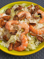 Seafood salad with shrimps, iceberg, rice and mushrooms. Vertical shot