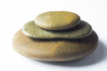 Fototapeta na wymiar close up of Zen Stones stapled on white background