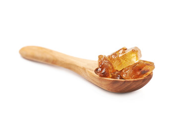 Wooden spoon full of sugar