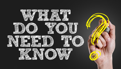 Hand writing the text: What Do You Need to Know?