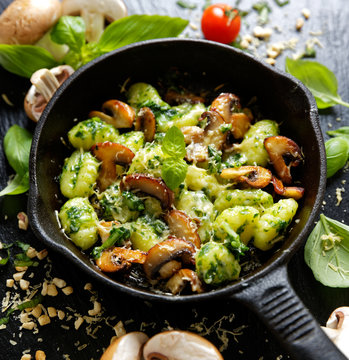 Potato Gnocchi with addition of herb pesto, cheese and mushrooms