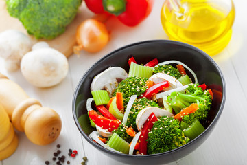 Bowl of delicious salad made of vegetables.  Healthy vegetarian food.