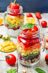 Fototapeta na wymiar homemade rainbow salads with vegetables, quinoa, Greek yogurt an
