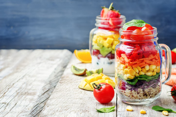 homemade rainbow salads with vegetables, quinoa, Greek yogurt an