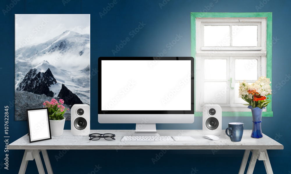 Poster computer display on office desk. isolated, white screen for mockup. creative modern desk with speake