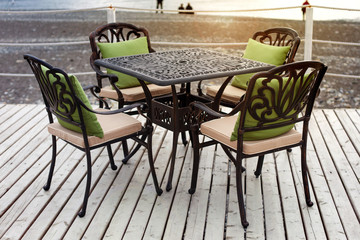 A table in a cafe on the beach at sunset