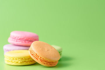 Five Colorful macaron on blue plain background
