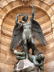 The statue of Saint Michael atop the fountain in the Place Saint-Michel at the northern end of the Boulevard Saint-Michel. Close up shot