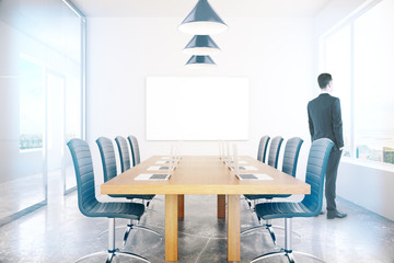 Conference room with businessman