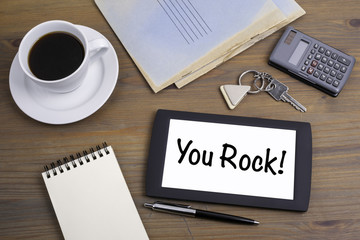 You Rock! Text on tablet device on a wooden table