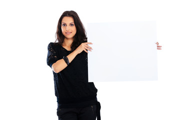 Young woman holding blank board isolated on white background and looking at the camera