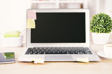 Fototapeta premium Desktop with laptop and phone