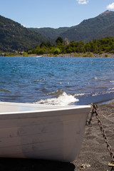 A boat on the shore of Lake Huechulafquen in Patagonia Argentina