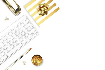 Flat lay, office white desk and keyboard with gold stationery. Gold stapler, stripe gold pattern, pencil. View top. Table up. Mock-up background
