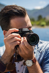 A young photographer at a lake