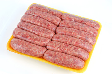 raw sausage in the container on white background