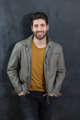 Fototapeta premium Portrait of a bearded man on chalkboard background