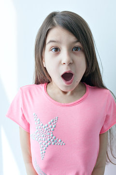 Little girl making a funny face. 